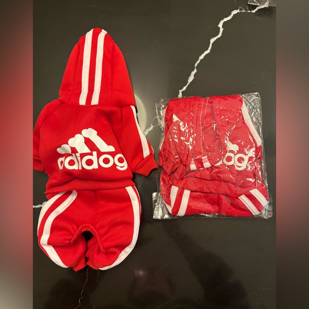 NEW matching Red track suit for small dogs. 2 size Small never worn